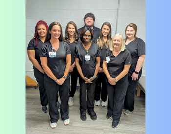 Seven females and one male Rehabilitation Services Staff, smiling
